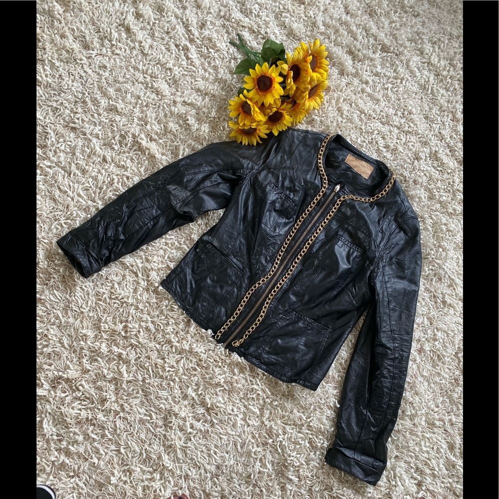 Super cute leather jacket with a gold chain trim